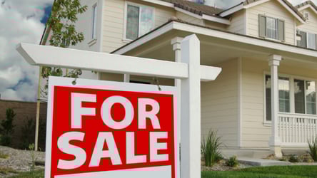 For Sale sign for a new house during the peak Spring Home Buying Season