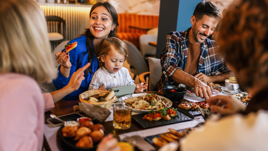 Family eating holiday meal at restaurant together with family