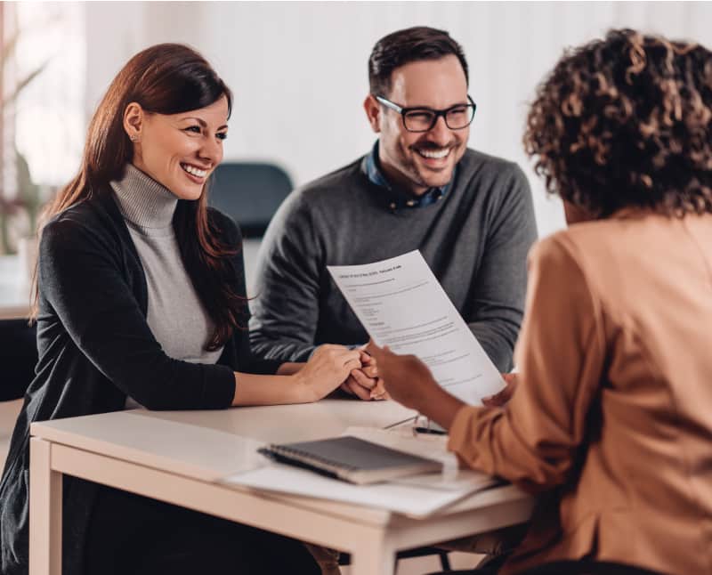 Couple consulting with a financial manager at the bank. Peace of mind with a certificate investment.
